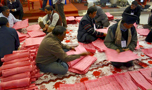 People counting ballot papers