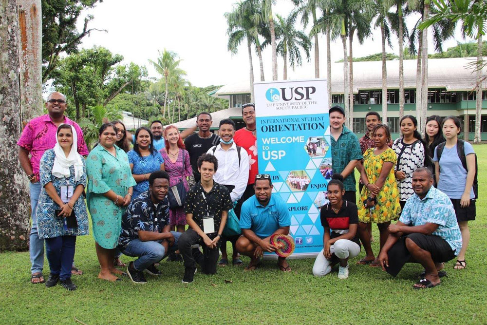 Group photo of Dean McCarthy with other international students at the University of the South Pacific