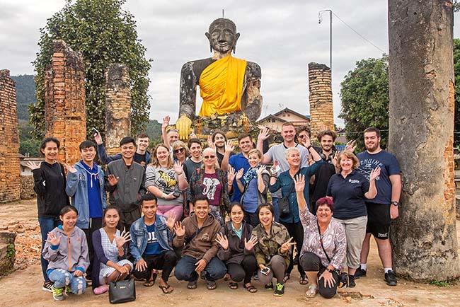 Students visit Wat Phia Wat temple in Muang Khoun. (Photo Credit: Nigel Chang)