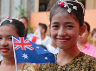 Photo of a school girl holding an Australian flag