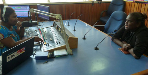 Photo of Leila in a radio station being interviewed by alice.