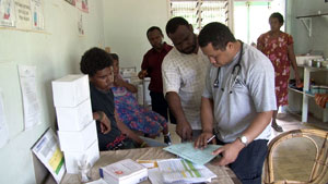 Western Province TB Coordinator, Able Marome and Daru Hosptial Registrar, Dr Kabe Vakadem review and assess the progress of TB patients