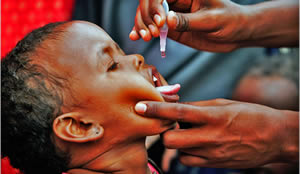 A child receiving an oral vaccination