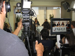 Camera man filming ’Praxis’ discussion forum
