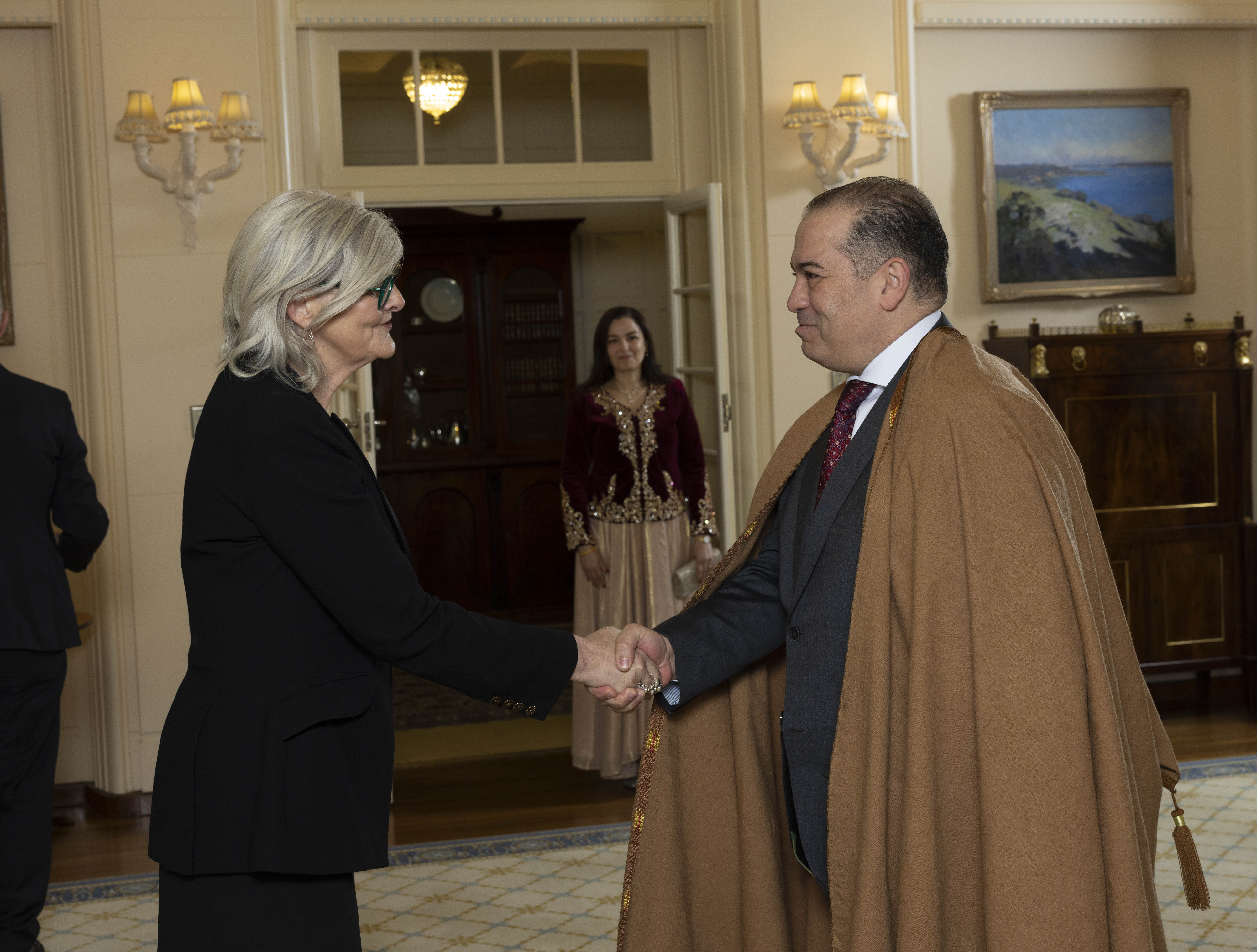 Image of His Excellency Mr Nafaa MAGHLAOUA, Ambassador of Algeria, shaking hands with the Governor-General of Australia Ms Sam Mostyn AC.