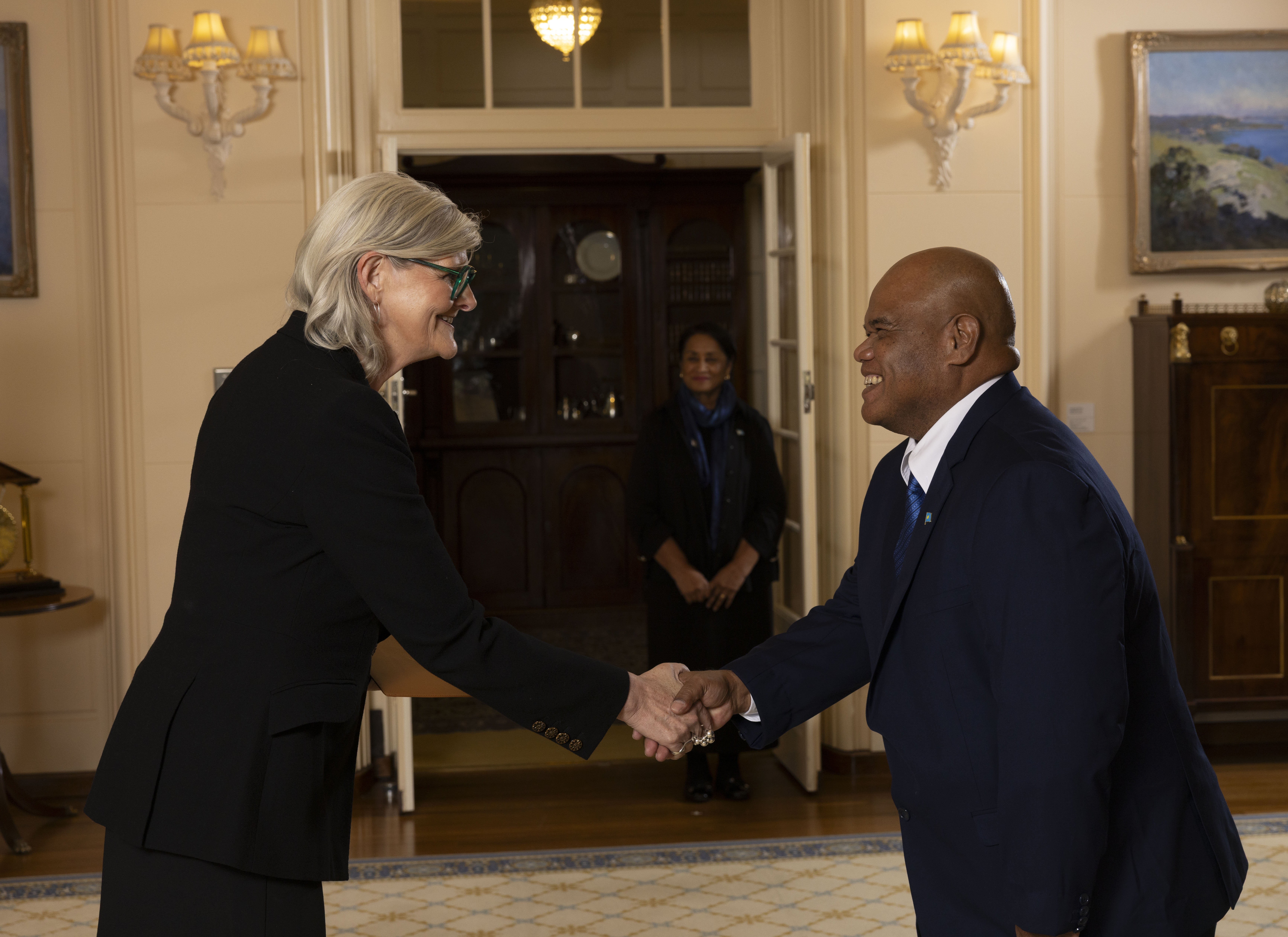 Image of His Excellency Mr Roland MERAR, Ambassador of Palau shaking hands with the Governor-General of Australia, Ms Sam Mostyn AC.