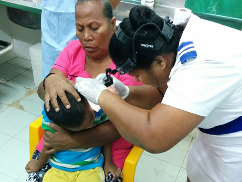 Doctor examining a child