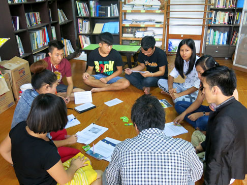 Students sitting in a circle.