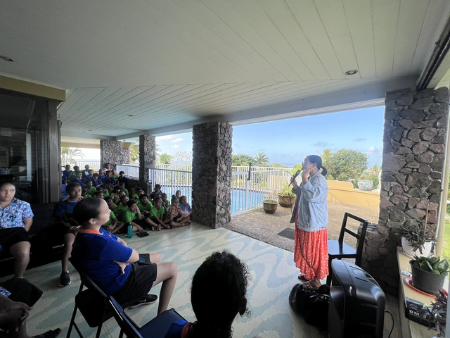 Rachel Spackman reading notices at the Pacific Nations School assembly (Photo credit: Temesia Tuicaumia)