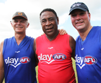 Photo of Mr Ian Kemish, Parliamentary Secretary Marles and Veari Maha in AFL garb