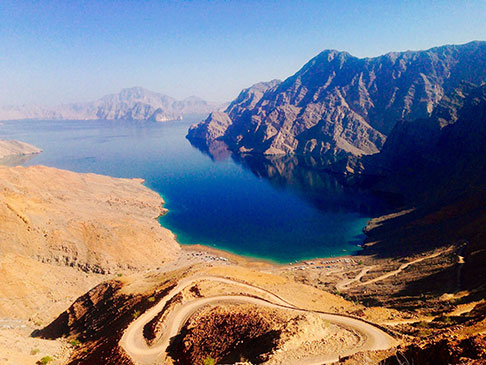 Aerial photo of road snaking down a hill