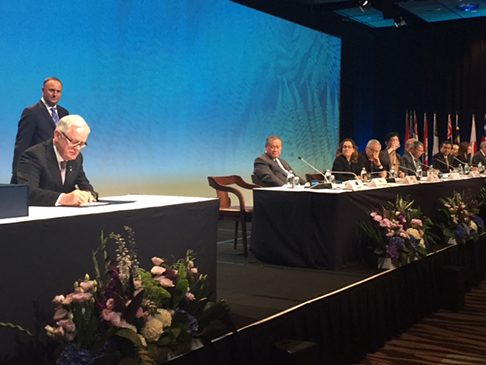 Minister Robb signing the TPP