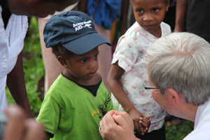 Mr Rudd meets a small boy in PNG