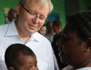Mr Rudd meets a mother and child