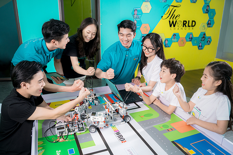 Two TEKY educators lead a STEM activity for children at a multidisciplinary innovation academy in Vietnam.