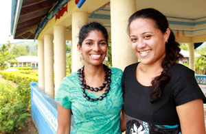Two women smiling at the camera