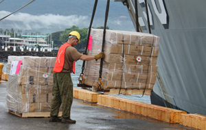 Red Cross supplies being unloaded from HMAS Tobruk.
