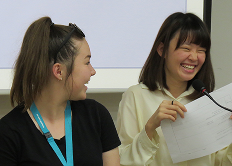 Two students chatting and smiling