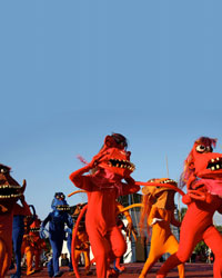 Photo of a demonstration with people in colourful animal costumes