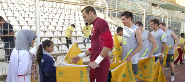 Legendary Australian goalkeeper Mark Schwarzer signs autographs ahead of his one hundredth appearance for his country
