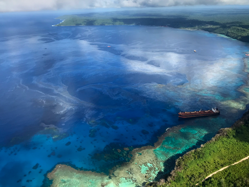 Aerial photograph of the tanker and a stream of oil in sea