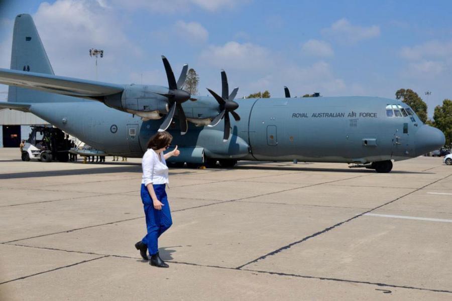 Australia’s Ambassador to Lebanon Rebekah Grindlay giving a thumbs up to the ADF C-130J Hercules aircraft at the airport. 
