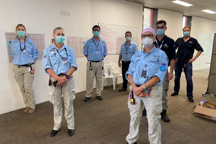 Five AUSMAT deployees and two DFAT employees take a socially distanced team photo before a scenario based exercise with PNG health officials.