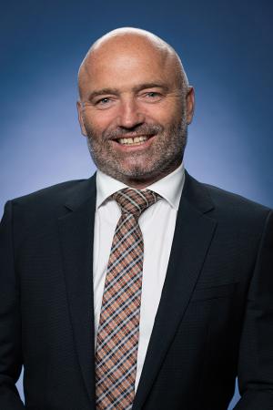 Portrait of Brek Batley.