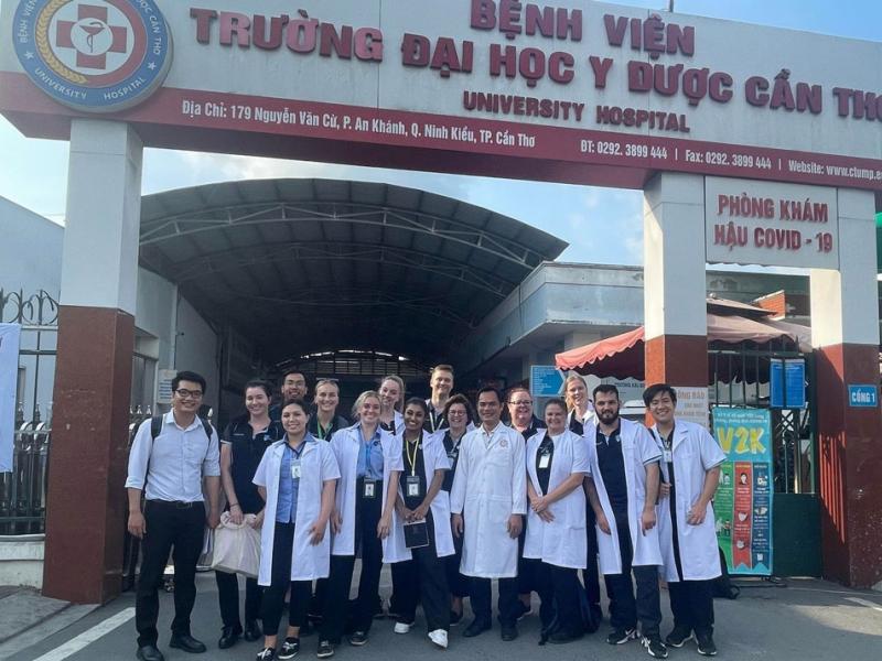 Group photo of the Central Queensland University sonography students in front of a clinic.