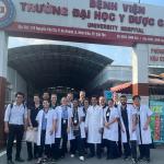 Group photo of the Central Queensland University sonography students in front of a clinic.