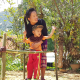 Ms Nang supports her son in his rehabilitation exercises.