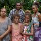 Arnold, his wife Ruthy, and their three children at his cocoa farm in the small village of Napapar, Papua New Guinea.