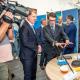 Photo of Myriota's co-founder and CEO Dr Alex Grant talking about IoT technology with SA Minister for Trade and Investment the Hon Stephen Patterson MP.