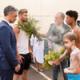 Photo of Movie director Taika Waititi and Actor Chris Hemsworth accepting a smoking leaves blessing from an Indigenous Australian during an Indigenous land acknowledgment ceremony.