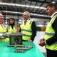 Two representatives from Star Scientific converse with Prime Minister Scott Morrison and the Minister Angus Taylor. All are wearing hi viz vests.
