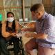 Australia’s former Deputy Head of Mission Luke Arnold visits with Battambang-based entrepreneur and disability activist, Ms Sieng Sokchan.