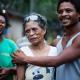 Photo of a man holding an elderly woman.
