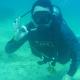 Photo of Dean McCarthy scuba diving underwater