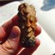 A part of the stem of an ornate smoking pipe in the form of a face (approx. 17th Century AD - ceramic) from the Wat Ban Vieng site. (Photo Credit: Nigel Chang)
