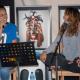 Photo of Emily Wurramara and Mereani Masani Official on stage smiling at each other.