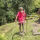 Photo of a farmer in Vanuatu using manual use farming tools.
