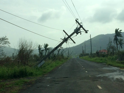 Power lines falling across a road
