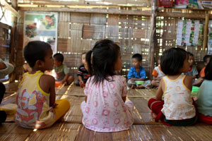 Children receive lunch at a nursery school as part of The Border Consortium activities to maximise nutrition for pre-school children at the camp at Ban Mae Nai Soi.