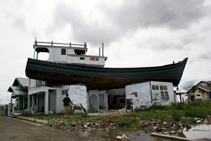 A boat sitting on top of a house