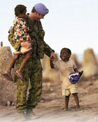 Image of a soldier with two boys
