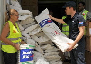 A man and woman loading emergency supplies
