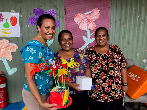Three women posing for photo outside Able-Disable Centre.