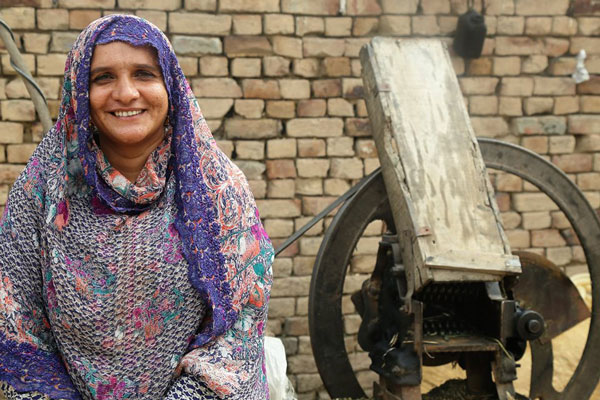 Woman and farm equipment