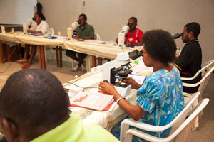 Microscopists from Provincial medical facilities undergo training under the supervision of the Chief Microscopist