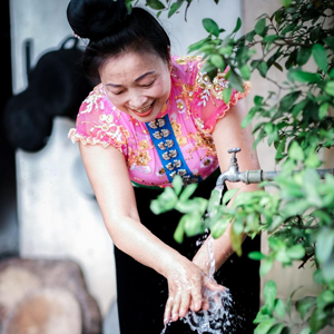 A Vietnamese woman washing her hands